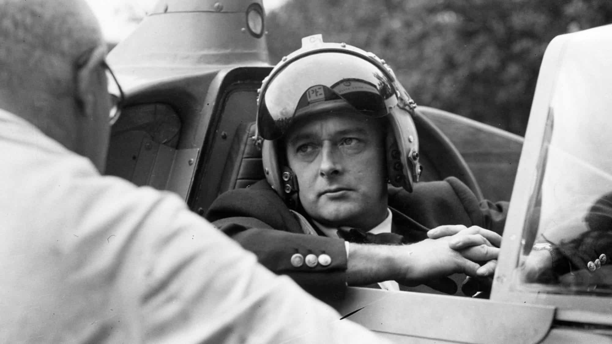 24th September 1958: Donald Campbell (1921 - 1967) in his jet hydroplane 'Bluebird' having a talk with his veteran mechanic Leo Villa. He is to attempt to break the water speed record on Coniston Water in the Lake District.