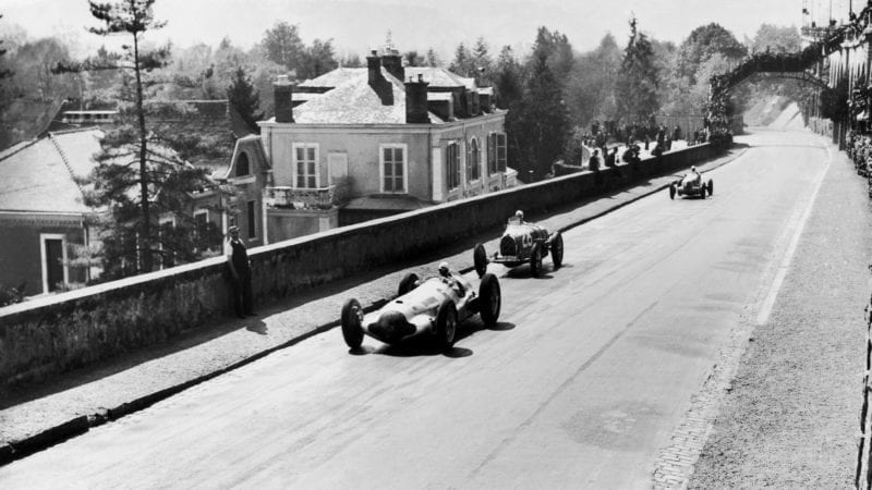 FRANCE - APRIL 11: On April 11, 1938 On The Racing Circuit Of The Grand Prix De Pau, The Mercedes-Benz W154 Piloted By Rudolf Caracciola (Number 6) Followed By Maurice Trintignant'S Bugatti T35-51 Runs Down A Straight Line At Full Speed. (Photo by Keystone-France/Gamma-Keystone via Getty Images)