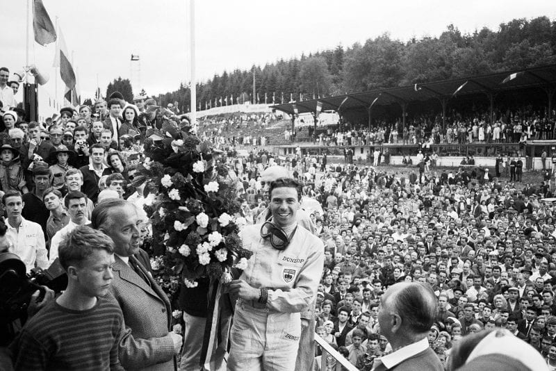 Jim Clark on the podium after winning the 1964 Belgian Grand Prix.