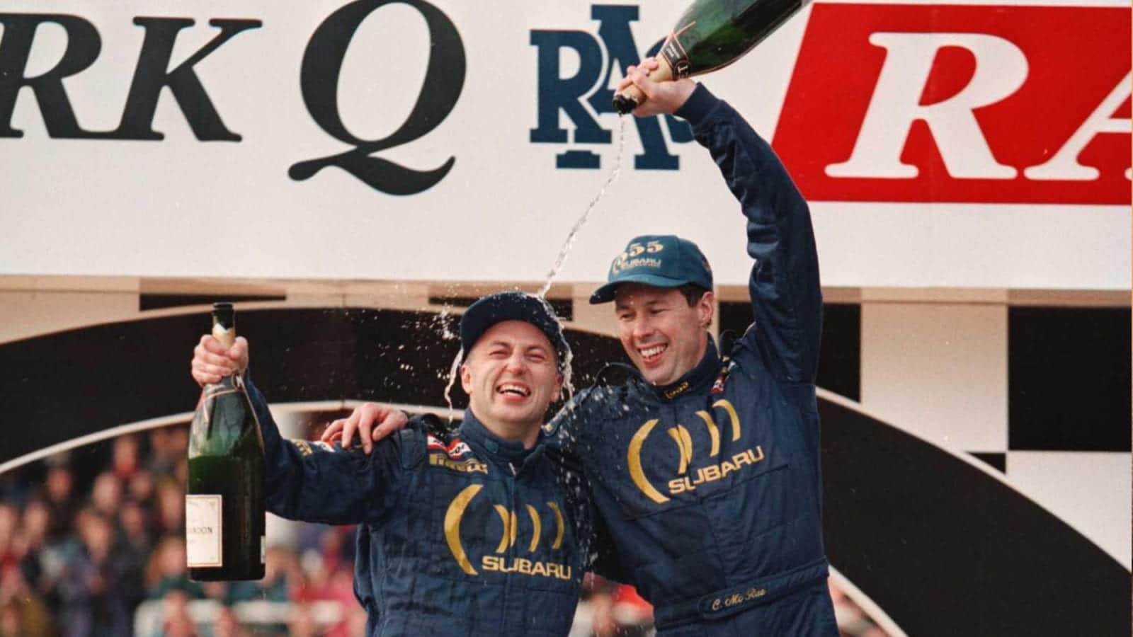 Colin McRae and Derek Ringer celebrate winning the 1995 RAC RAlly and the World Rally Championship