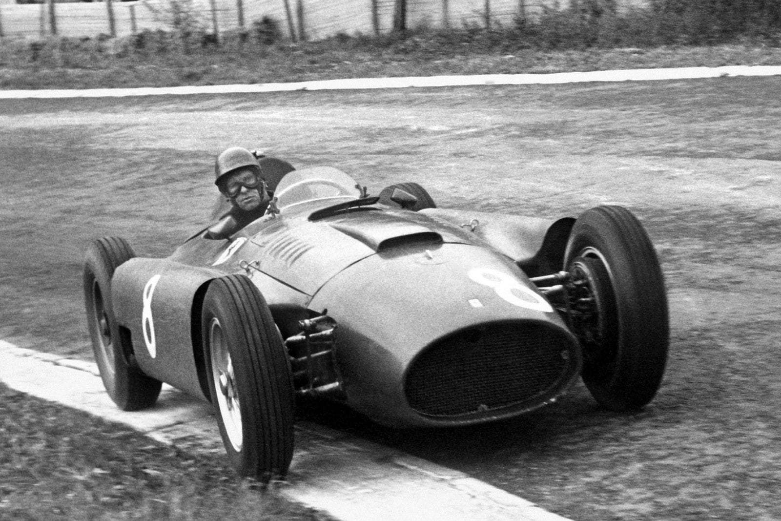 Peter Collins (Lancia-Ferrari D50) on his way to winning the 1956 Belgian Grand Prix, Spa-Francorchamps.