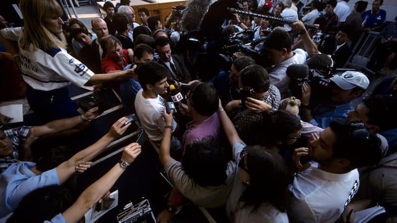 Damon Hill surrounded by media in Japan 1996
