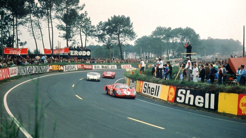 Dan Gurney and AJ Foyt's Ford MkIV leads Chris Amon and Nino Vaccarella's Ferrari 330 P4