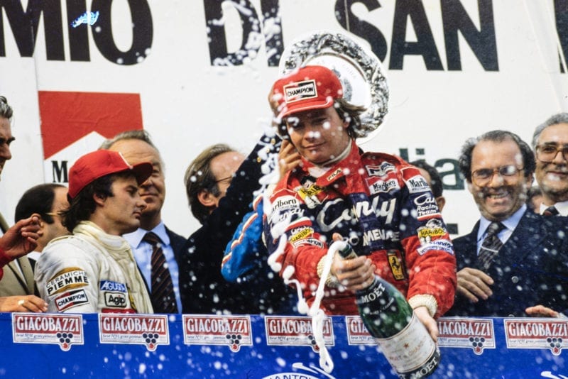 Didier Pironi sprays champagne at Imola in 1982 as Gilles Villeneuve looks away