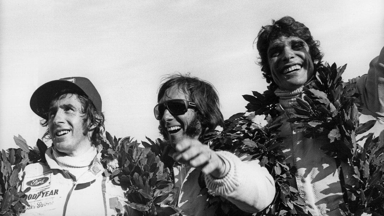 Emerson Fittipaldi Francois Cevert and JAckie Stewart on the podium at the 1973 Argentinian Grand Prix