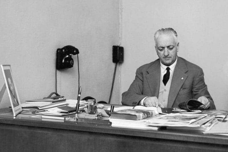Italian car manufacturer Enzo Ferrari (1898 - 1988) at his desk, circa 1955. (Photo by Keystone/Hulton Archive/Getty Images)