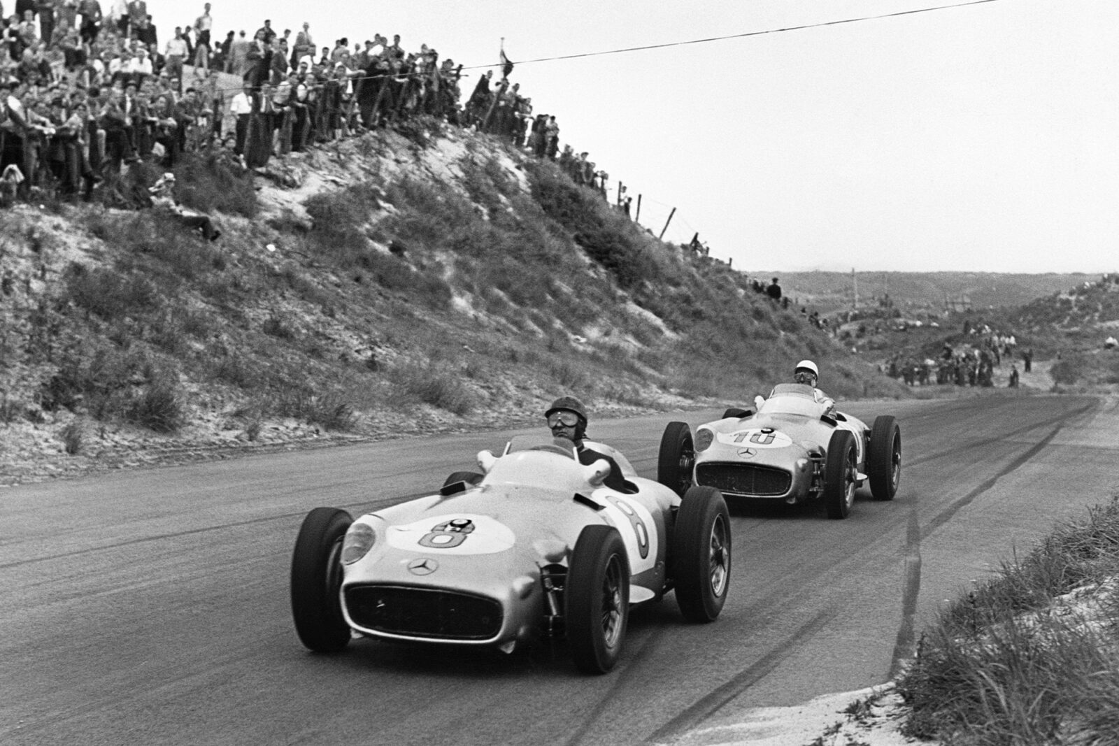 Juan Manuel Fangio (Mercedes-Benz W196),1st position, leads Stirling Moss (Mercedes-Benz W196), 2nd position at the 1955 Dutch Grand Prix, Zandvoort.