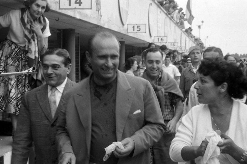 Juan Manuel Fangio smiles upon relasing he is champion for the fourth time.