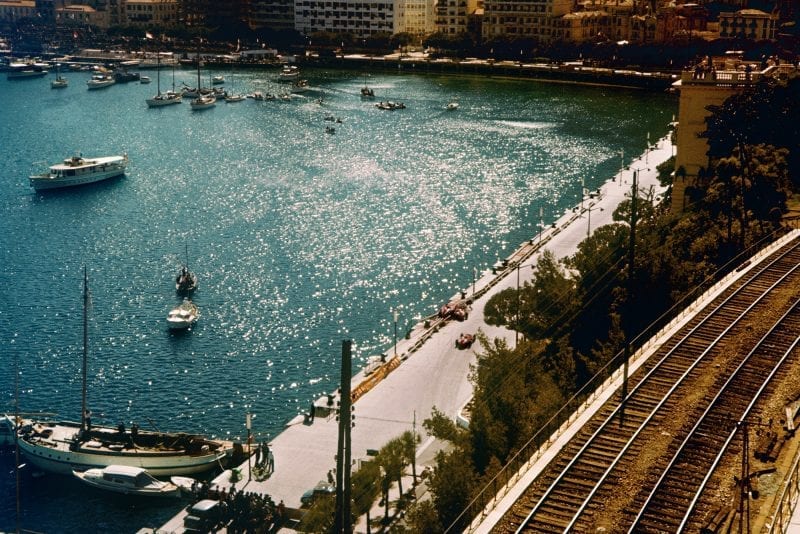 The stricken cars of Mike Hawthorn and Peter Collins lie next to the harbour at the 1957 Monaco Grand Prix.