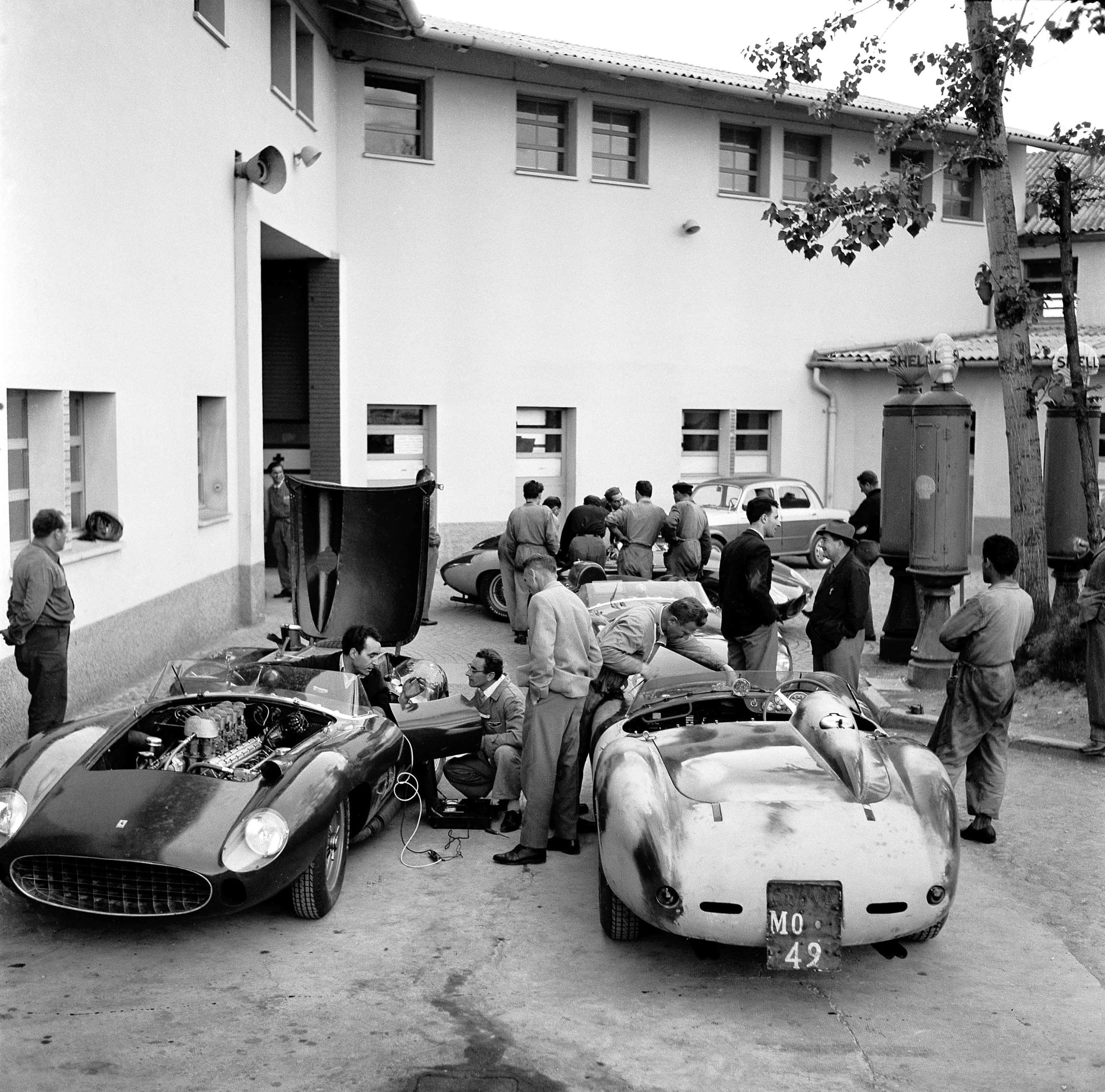 Before The Mille Miglia; Maranello, May 1957. The team cars (the famous type 315 and 335 Sport four-camshaft models to be driven by Taruffi, von Trips, Collins and de Portago) being prepared in the factory courtyard at Maranello with the Collins/Klemantaski car at the left. It is almost like a ballet in rehearsal. (Photo by Klemantaski Collection/Getty Images)