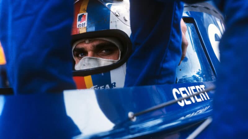 Francois Cevert looks out from helmet while sat in Tyrrell F1 car