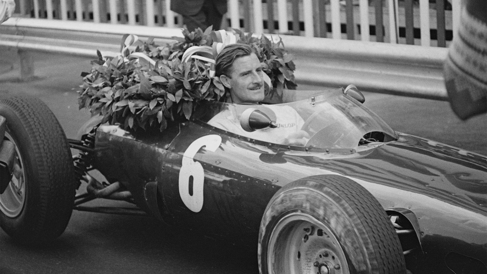 English racing driver Graham Hill (1929-1975) pictured in the driver's seat of the #6 Owen Racing Organisation BRM P57 BRM P56 1.5 V8 racing car after finishing in first place to win the 1963 Monaco Grand Prix in Monte Carlo on 26th May 1963. (Photo by Express/Hulton Archive/Getty Images)