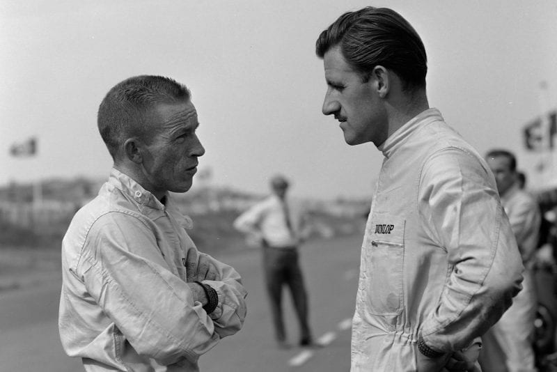 BRM team-mates Ginther and Hill confer.