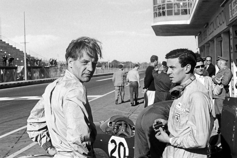 Innes Ireland with Jim Clark in the pits at the 1961 Syracuse Grand Prix