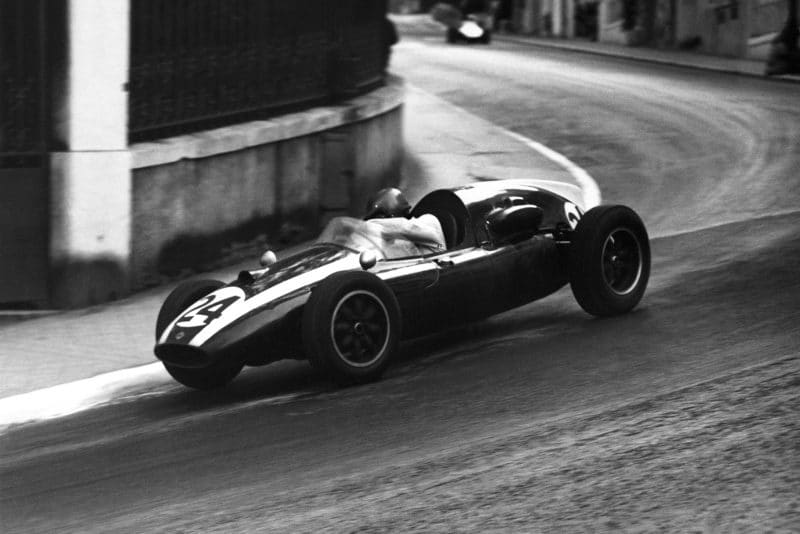 Jack Brabham pushes his Cooper T51-Climax into 1st place.