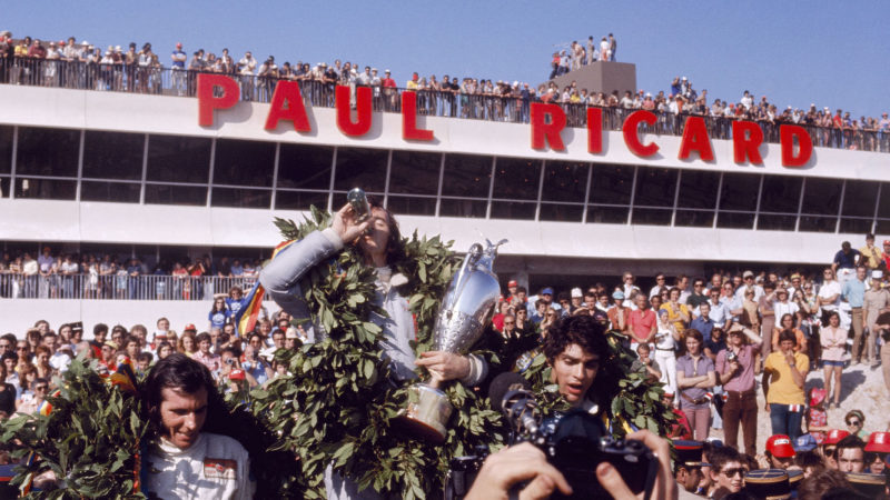 Jackie Stewart celebrates winning the 1971 French GP in front of the Paul Ricard stand