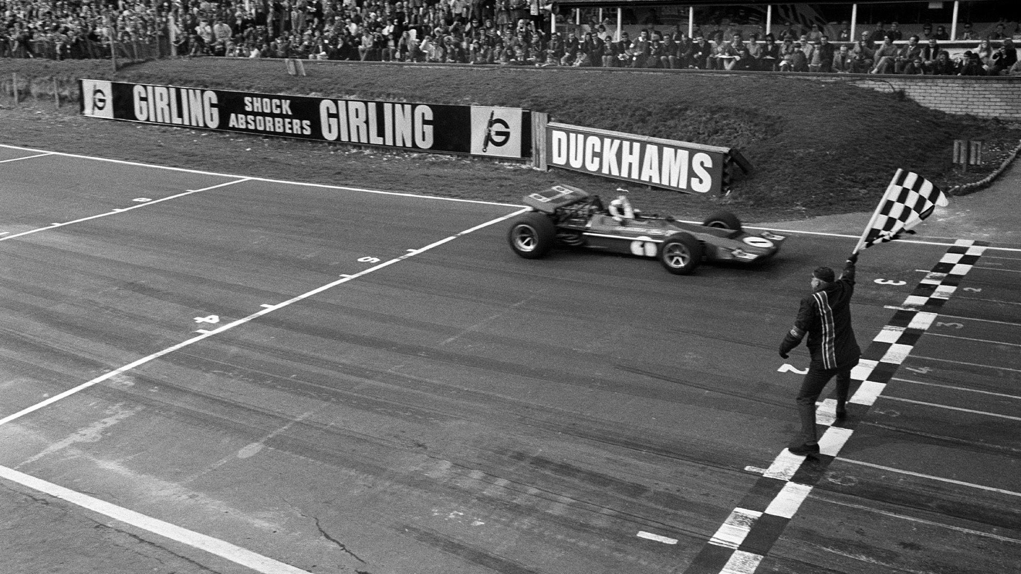 Jackie Stewart takes the chequered flag to win 1970 Race of Champions in March 701