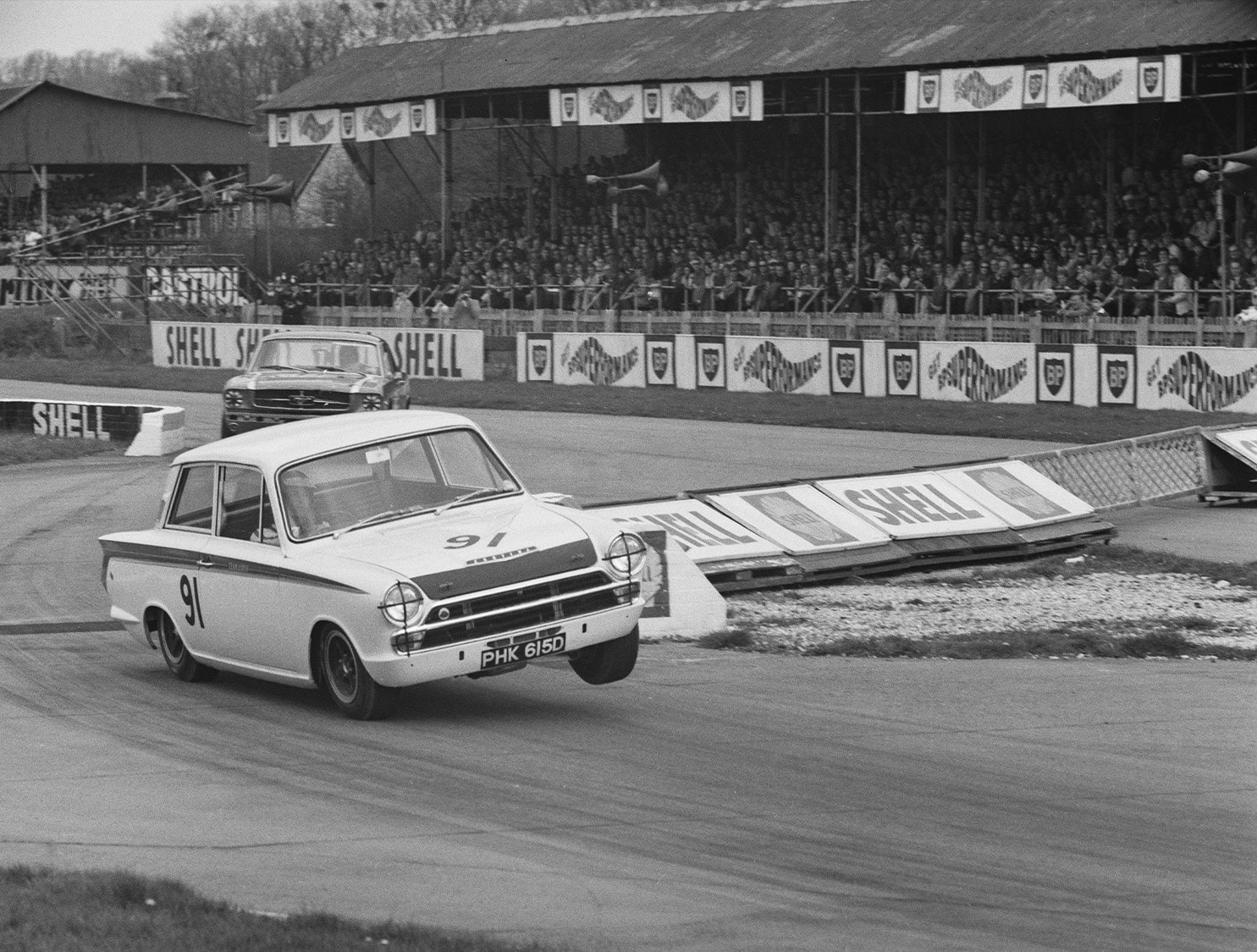 Jim Clark in a Lotus Cortina at goodwood in 1966