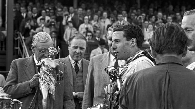 Jim Clark with the trophy for winning 1962 British Grand Prix at Aintree