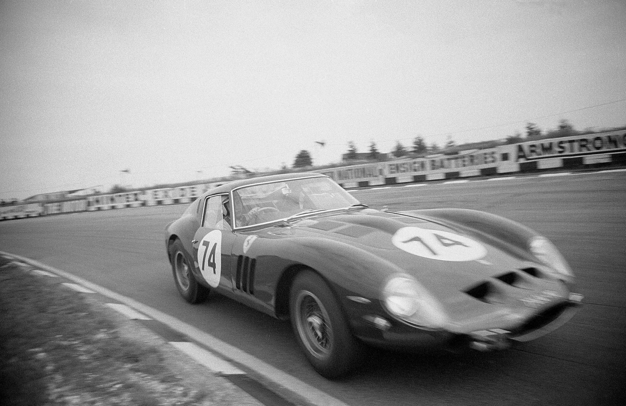 John Surtees, in the Bowmaker Ferrari 250GTO, driving through Paddock Bend during a practise session for the Peco Trophy Race, Brands Hatch, 5th August 1962. (Photo by Klemantaski Collection/Getty Images)