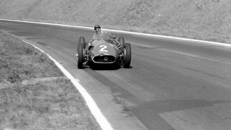 Juan Manuel Fangio sliding down the hill at Rouen les Essarts in 1957
