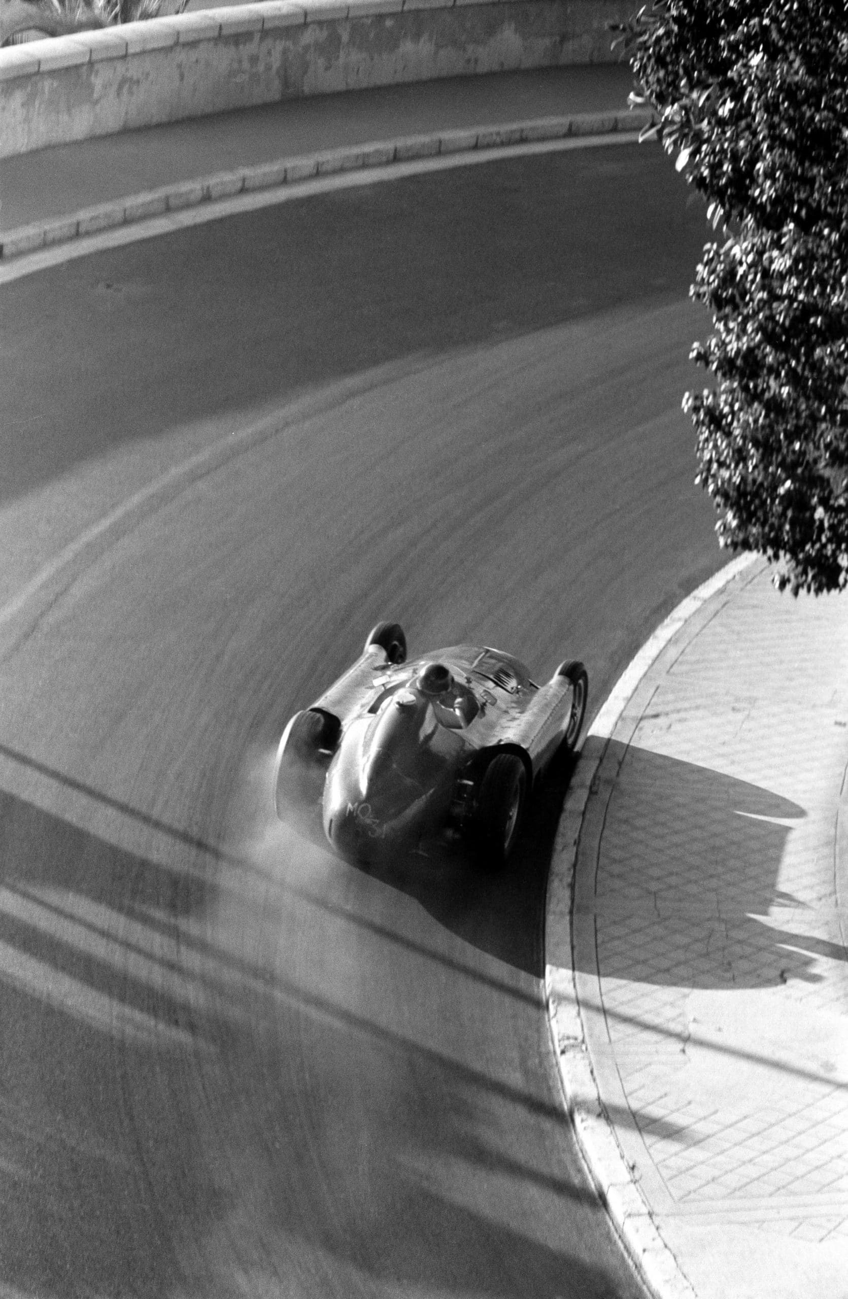 Juan Manuel Fangio of Argentina driving the #28 Scuderia Ferrari Lancia-Ferrari D50 Ferrari V8, drifts around Mirabeau during an early morning practice for the Monaco Grand Prix, Monte Carlo, 13th May 1956. (Photo by Klemantaski Collection/Getty Images)