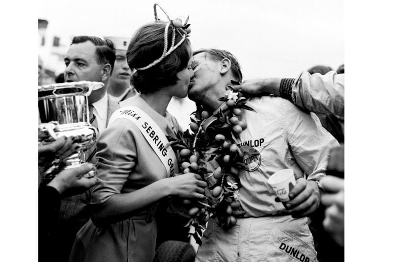 Race winner Bruce McLaren gets a kiss abd his garland from Miss Sebring Grand Prix.