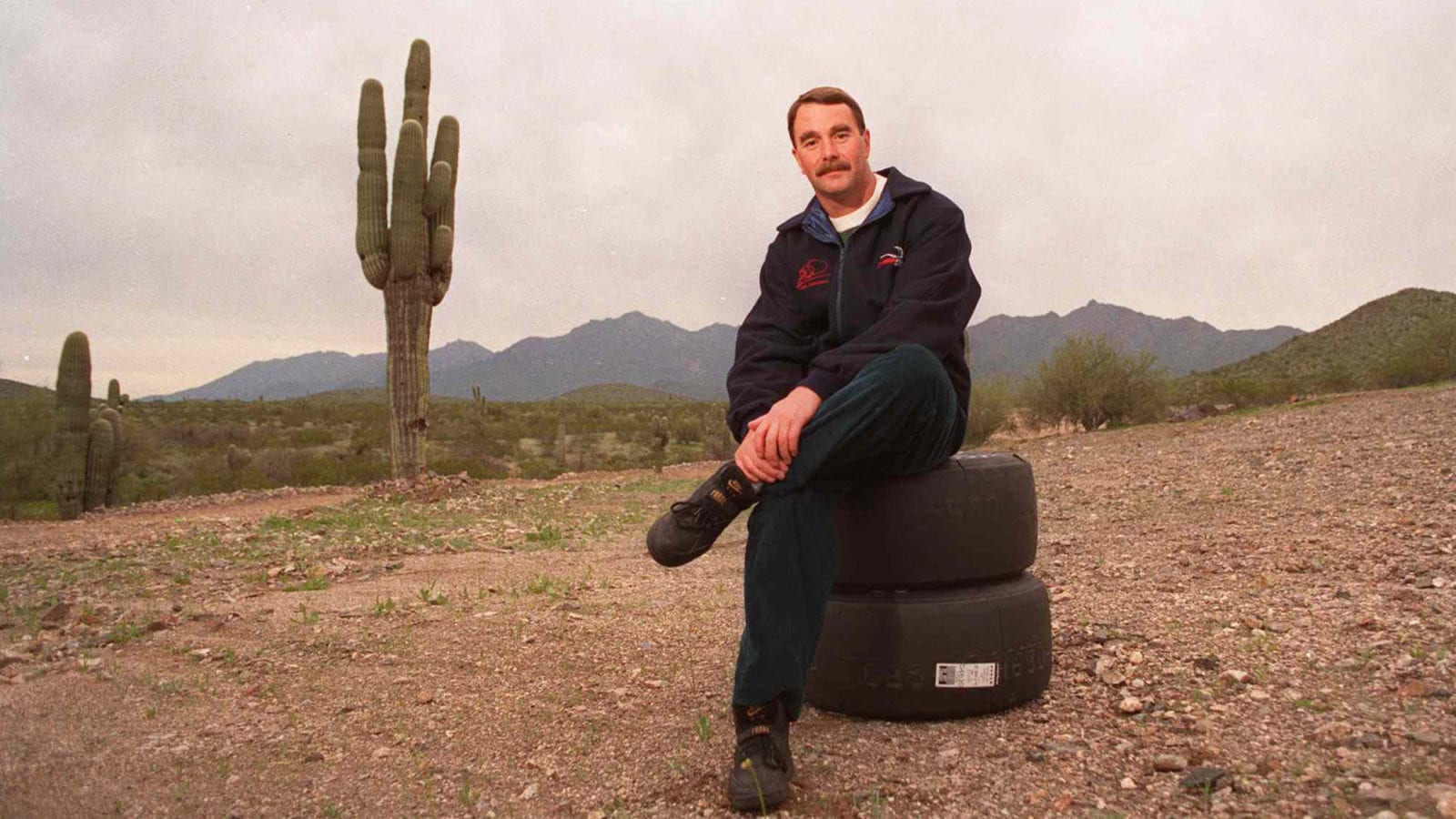 Nigel Mansell Formula One Racing Champion Now Indy Driver Sitting In Arizona Desert February 1993- (Photo By Paul Harris/Getty Images)