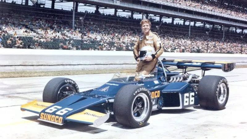 Mark Donohue poses next to his 1972 Indy 500-winning car