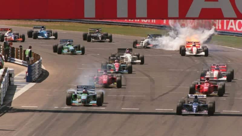 Martin Brundle's McLaren bursts into flames at the start of the 1994 F1 British Grand Prix at Silverstone