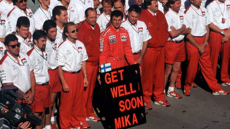 McLaren team holds a Get well soon Mika board after Hakkinen's crash in the build up to the 1995 Australian Grand Prix at Adelaide