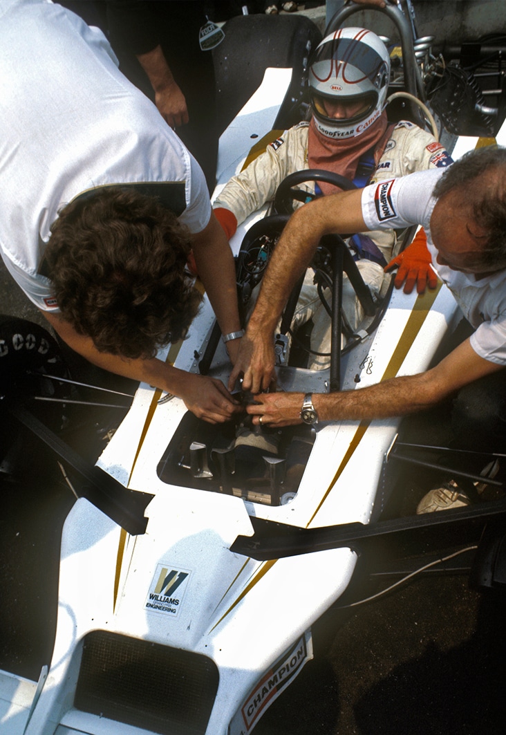 Mechanics work on Williams F1 car of Alan Jones