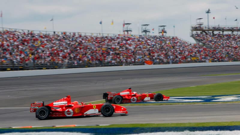 Michael Schumacher runs Rubens Barrichello off the track at the 2005 F1 United States GP