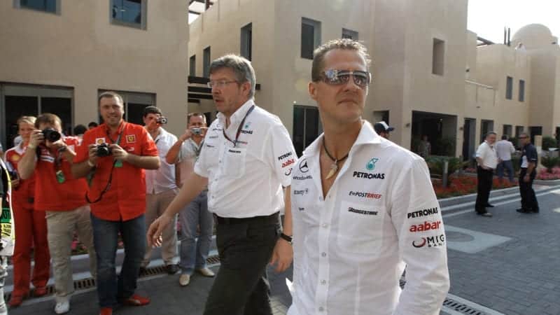 Michael Schumacher with Ross Brawn at the 2010 Abu Dhabi Grand Prix
