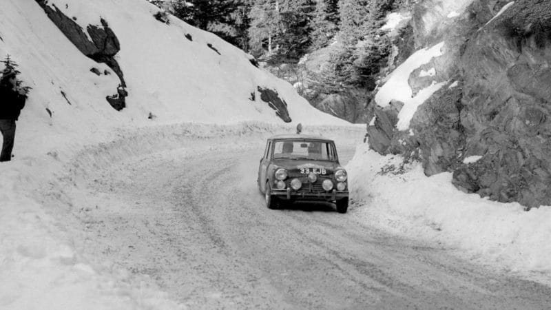 Mini of Paddy Hopkirk on a snowy mountain pass on the 1964 Monte Carlo Rally