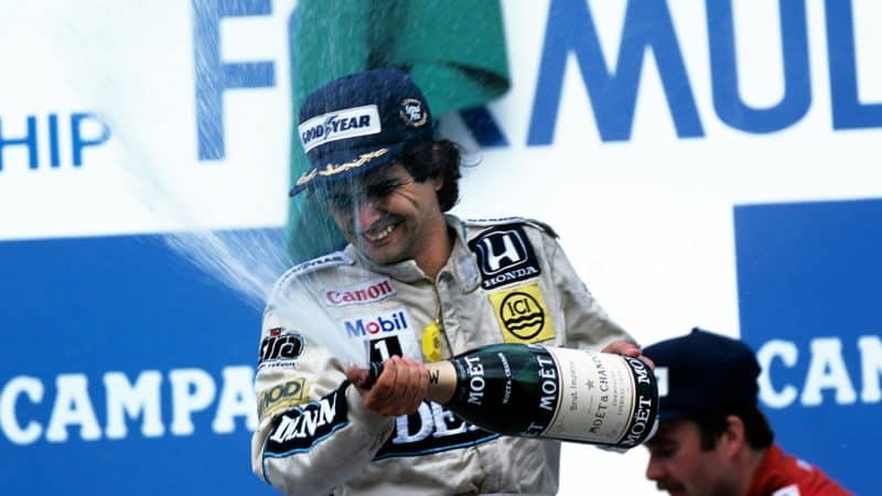 Nelson Piquet sprays champagne