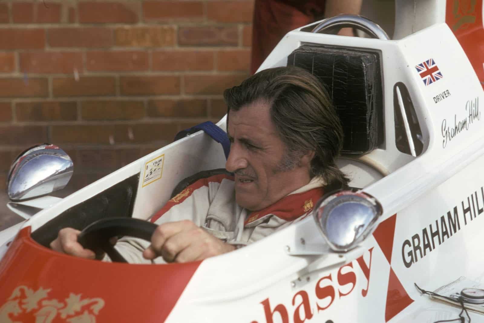 Graham Hill in his Lola Hill-Ford in the pits during practice for the 1974 South African Grand Prix in Kyalami. Photo: Grand Prix Photo
