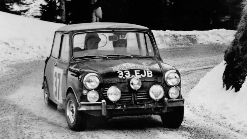 Paddy Hopkirk drives through the snow in his Mini Cooper on the 1964 Monte Carlo Rally