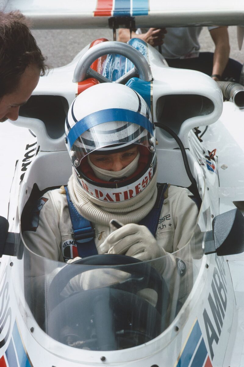 Riccardo Patrese and Elio de Angelis, sit on the tyres of the new