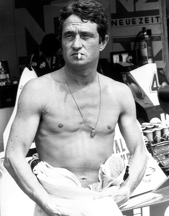 Patrick Depailler smoking in F1 pitlane