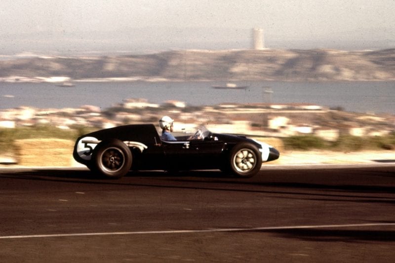 Maurice Trintignant at the wheel of his Cooper T51 Climax.
