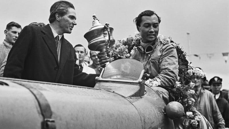 Prince Bira holds JCC International Trophy in his White Mouse Maserati