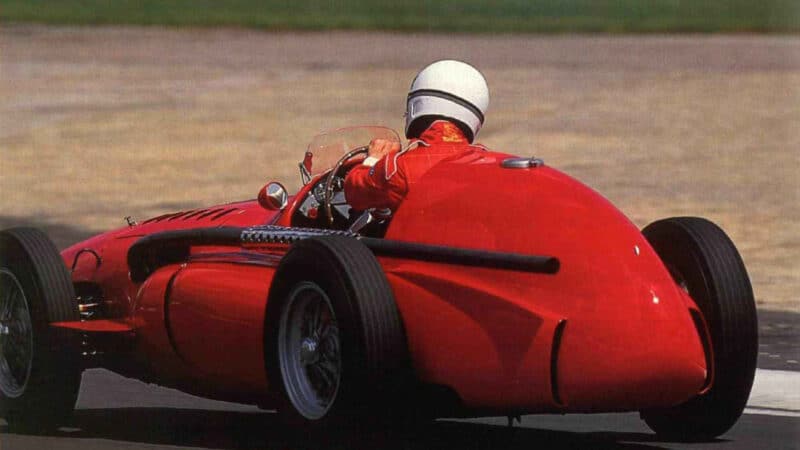 Rear view of Ferrari 555 F1 car on track