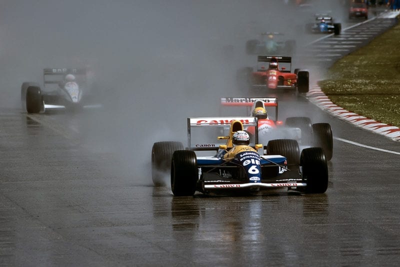 Riccardo Patrese leads at the start of the 1991 F1 San Marino Grand Prix at Imola