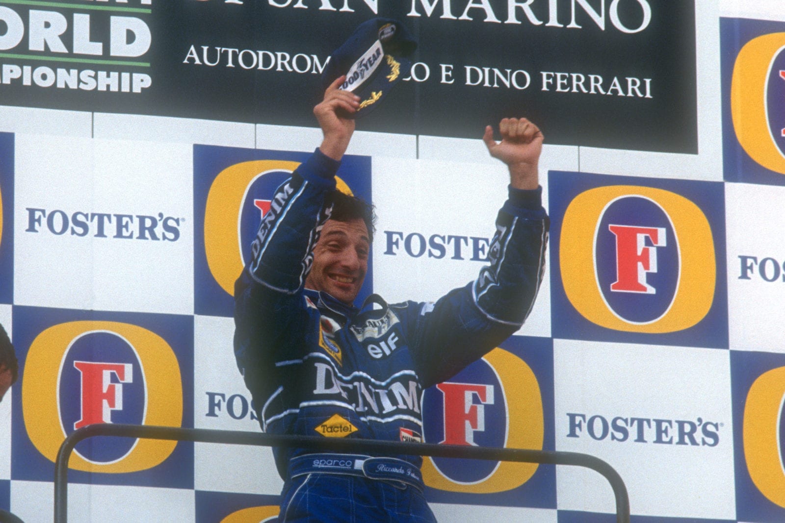 Riccardo Patrese on the podium after winning the 1991 San Marino Grand Prix
