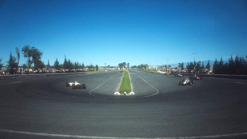 Ritchie Ginther and Mike Spence round the hairpin at 1965 Mexican Grand Prix