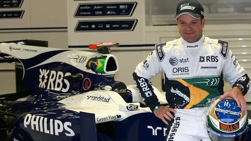 Rubens Barrichello sits on his Williams F1 car as he marks his 300th F1 race at the 2010 Belgian Grand Prix