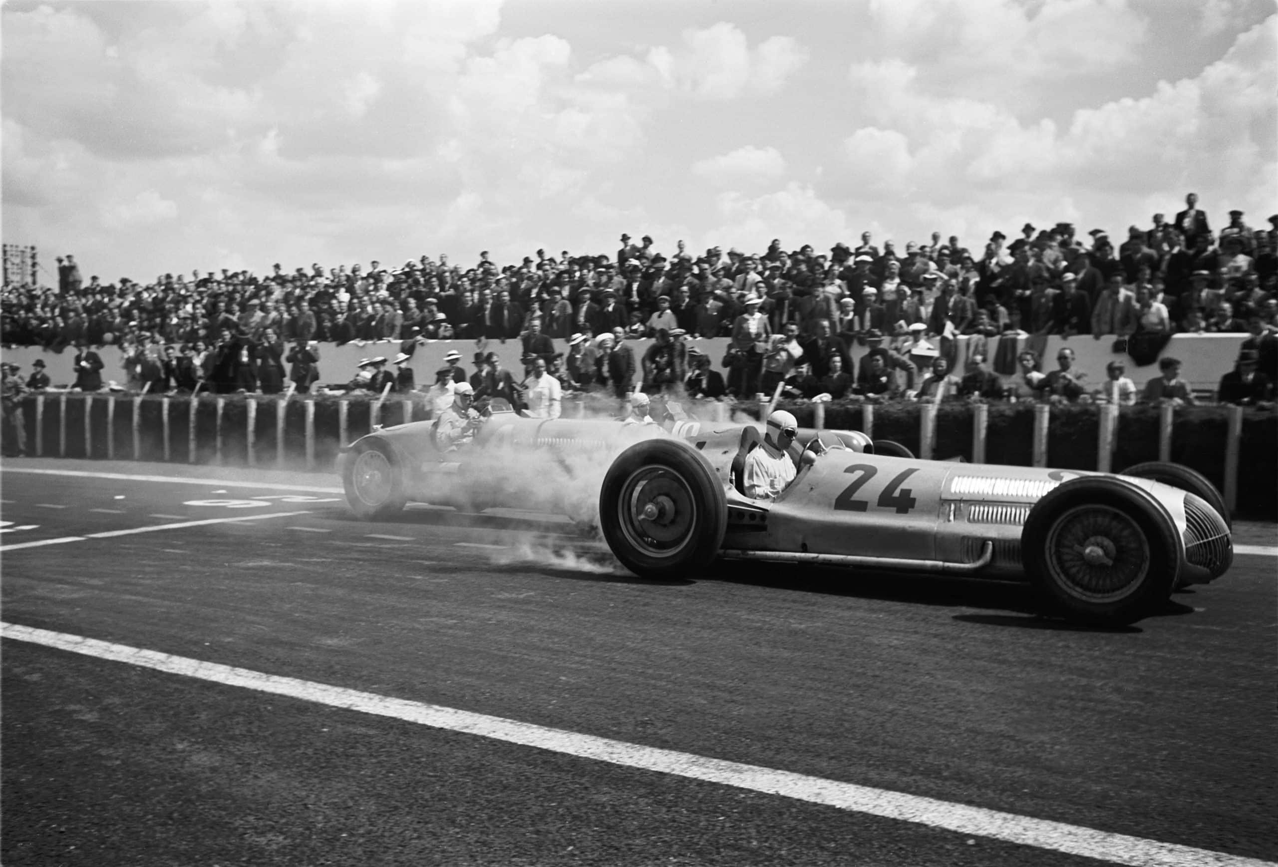 The French Grand Prix; Reims-Geuex, July 3, 1938. Rudolph Caracciola making a magnificent start in his Mercedes W154, his tire smoke almost hiding the car behind him. He finished second behind Manfred vonBrauchitsch and was followed by Hermann Lang in a Mercedes sweep. (Photo by Klemantaski Collection/Getty Images)