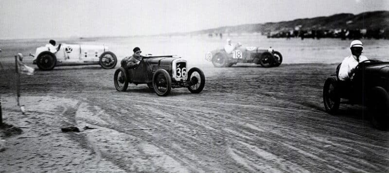 1920s cars cornering during beach race