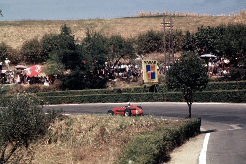 harry Schell rides down the hill in his Maserati 250F, 1957 Pescara Grand Prix